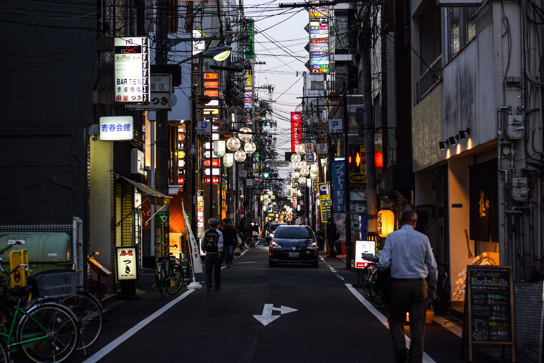 people walking on street during night time